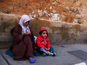 A Moroccan mother and child beg for money in Rabat, Morocco, last year. About 15 percent of the population lives on $2 a day, and the literacy rate is little more than 50 percent. A Moroccan mother and child beg for money in Rabat, Morocco, last year. About 15 percent of the population lives on $2 a day, and the literacy rate is little more than 50 percent.