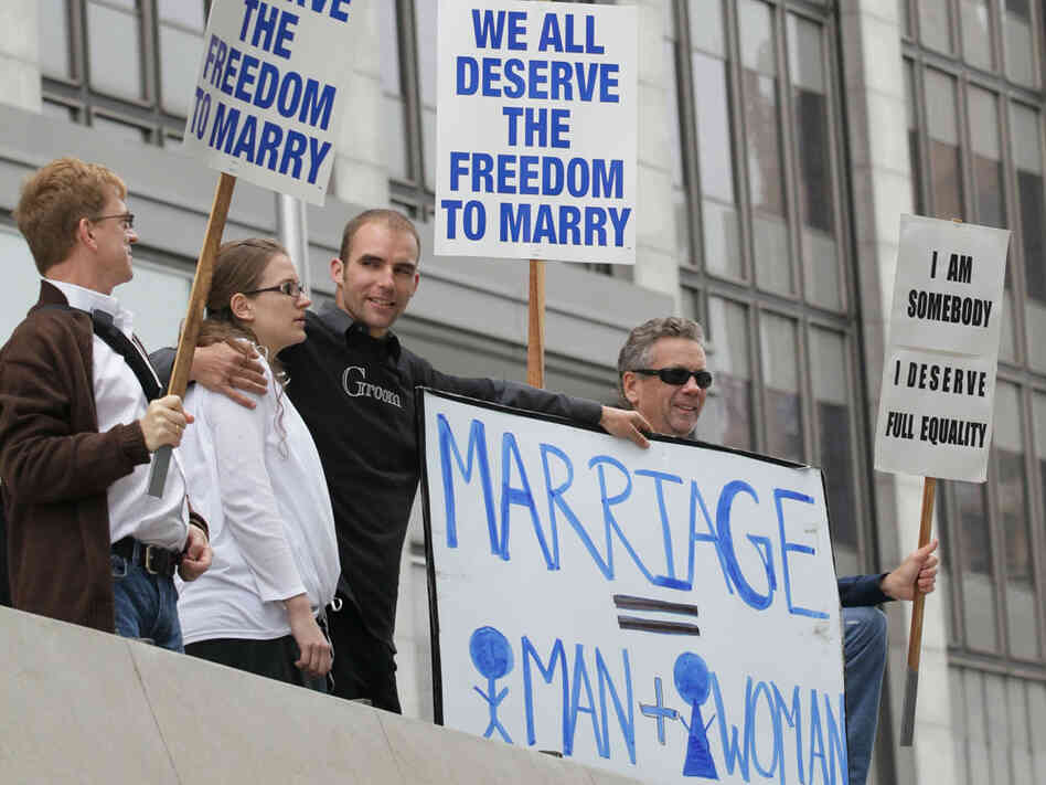 Prop 8 supporters Nadia Chayka (2-L) and her fiance Luke Otterstad (3-L) stand in between Prop 8 opponents Billy Radford (R) and Ron Weaver (L) as they stand outside of the Philip Burton Federal building August 4, 2010 in San Francisco, California. Prop 8 supporters Nadia Chayka (2-L) and her fiance Luke Otterstad (3-L) stand in between Prop 8 opponents Billy Radford (R) and Ron Weaver (L) as they stand outside of the Philip Burton Federal building August 4, 2010 in San Francisco, California.