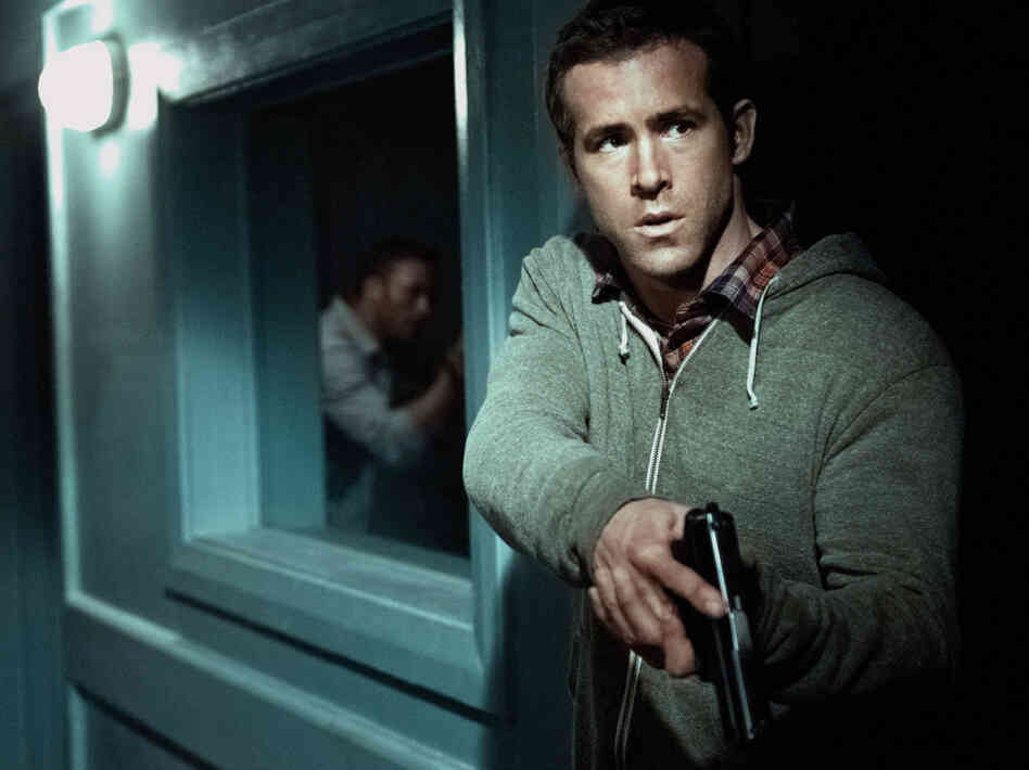 Inexperienced field agent Matt Weston (Ryan Reynolds) prepares to fend off an attack on his CIA safe house in Cape Town, South Africa. Inexperienced field agent Matt Weston (Ryan Reynolds) prepares to fend off an attack on his CIA safe house in Cape Town, South Africa.