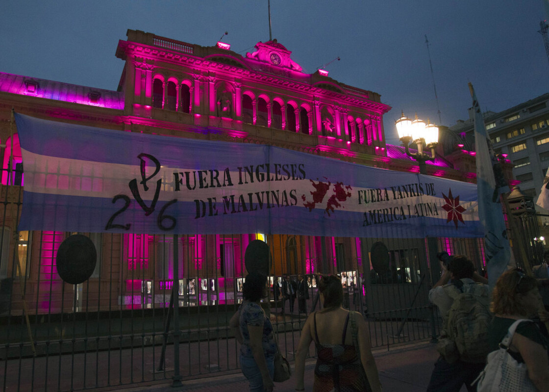 The sign reads "British, get our of the Malvinas (Falklands)." It hangs outside the Government Palace, known as 'Casa Rosada', in Buenos Aires, Argentina.