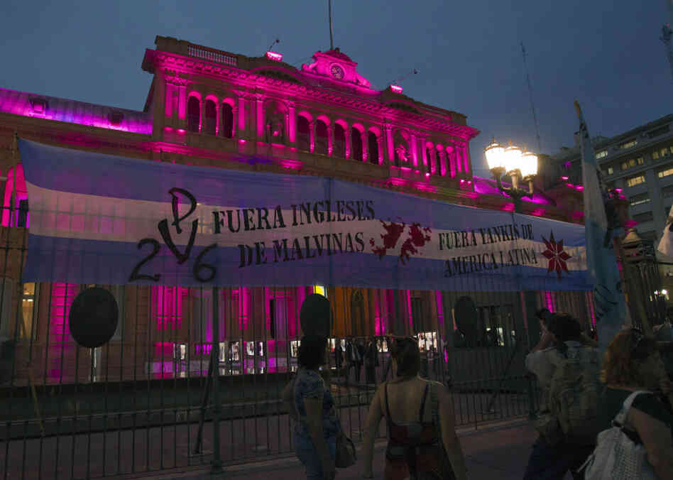 The sign reads "British, get our of the Malvinas (Falklands)." It hangs outside the Government Palace, known as 'Casa Rosada', in Buenos Aires, Argentina.