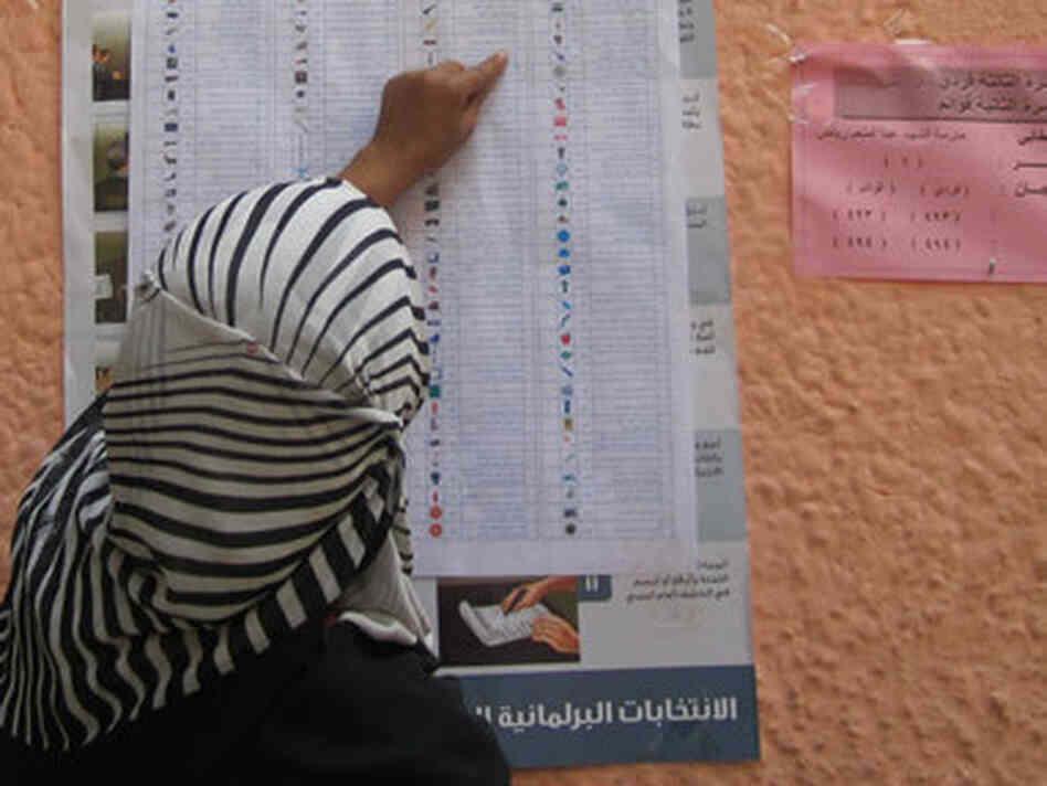 A voter checks a sample ballot outside a polling station during the second round of municipal elections in Egypt. The National Democratic Institute says it has helped mobilize volunteers and make parties aware of citizens' needs in Egypt without promoting a particular ideology. A voter checks a sample ballot outside a polling station during the second round of municipal elections in Egypt. The National Democratic Institute says it has helped mobilize volunteers and make parties aware of citizens' needs in Egypt without promoting a particular ideology.