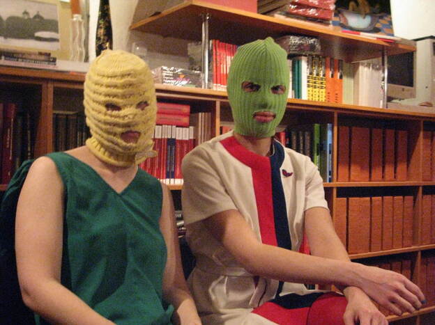 "Kot" (left) and "Schumacher," members of the feminist collective, say their group will be staging more illegal anti-government performances around Moscow in the weeks leading up to the March 4 presidential elections. They say they were galvanized originally by their opposition to government policies against women.