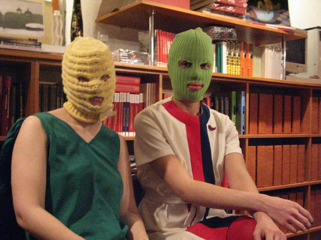 "Kot" (left) and "Schumacher," members of the feminist collective, say their group will be staging more illegal anti-government performances around Moscow in the weeks leading up to the March 4 presidential elections. They say they were galvanized originally by their opposition to government policies against women.