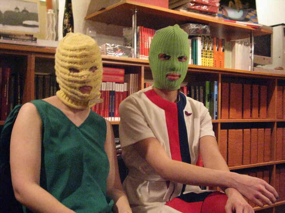 "Kot" (left) and "Schumacher," members of the feminist collective, say their group will be staging more illegal anti-government performances around Moscow in the weeks leading up to the March 4 presidential elections. They say they were galvanized originally by their opposition to government policies against women.