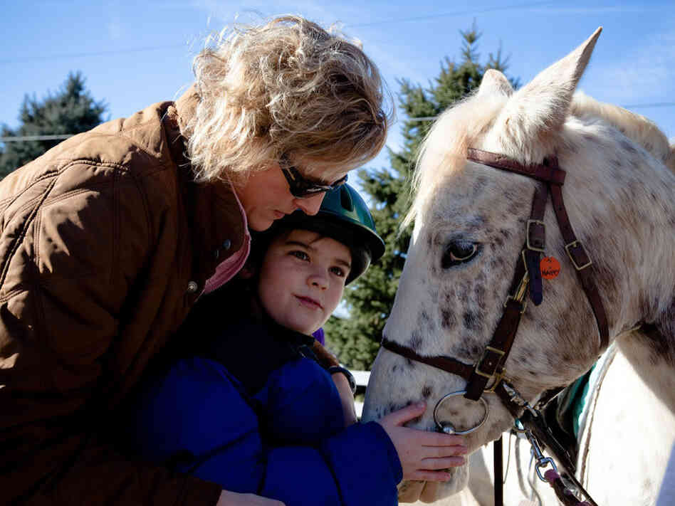 Cathy Coleman is a speech pathologist for the Northern Virginia Therapeutic Riding Program. She uses a horse named Happy in her therapy sessions with 9-year-old Ryan Shank-Rowe, who has autism. Cathy Coleman is a speech pathologist for the Northern Virginia Therapeutic Riding Program. She uses a horse named Happy in her therapy sessions with 9-year-old Ryan Shank-Rowe, who has autism.