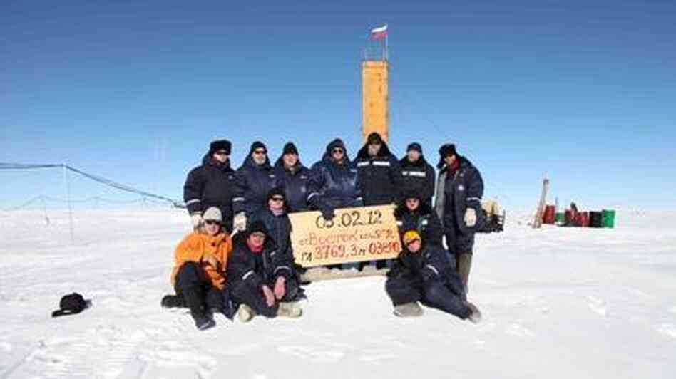 In Antarctica, Russian scientists posed at the site where they say they've drilled through to Lake Vostok. The sign indicates that the breakthrough happened on Feb. 5, 2012. In Antarctica, Russian scientists posed at the site where they say they've drilled through to Lake Vostok. The sign indicates that the breakthrough happened on Feb. 5, 2012.
