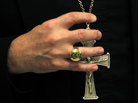 A bishop grasps his pectoral cross during the United States Conference of Catholic Bishops in Baltimore on Nov. 14, 2011. A bishop grasps his pectoral cross during the United States Conference of Catholic Bishops in Baltimore on Nov. 14, 2011.
