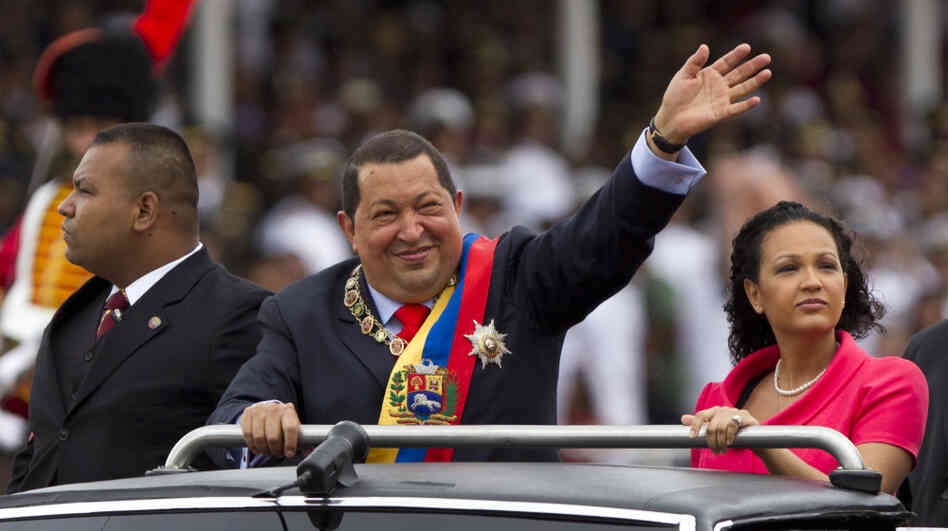 President Hugo Chavez waves during a military parade in Caracas, Venezuela, to commemorate the 20th anniversary of a failed coup attempt he led. After battling cancer last year, Chavez has returned to his high-profile, fiery ways.
