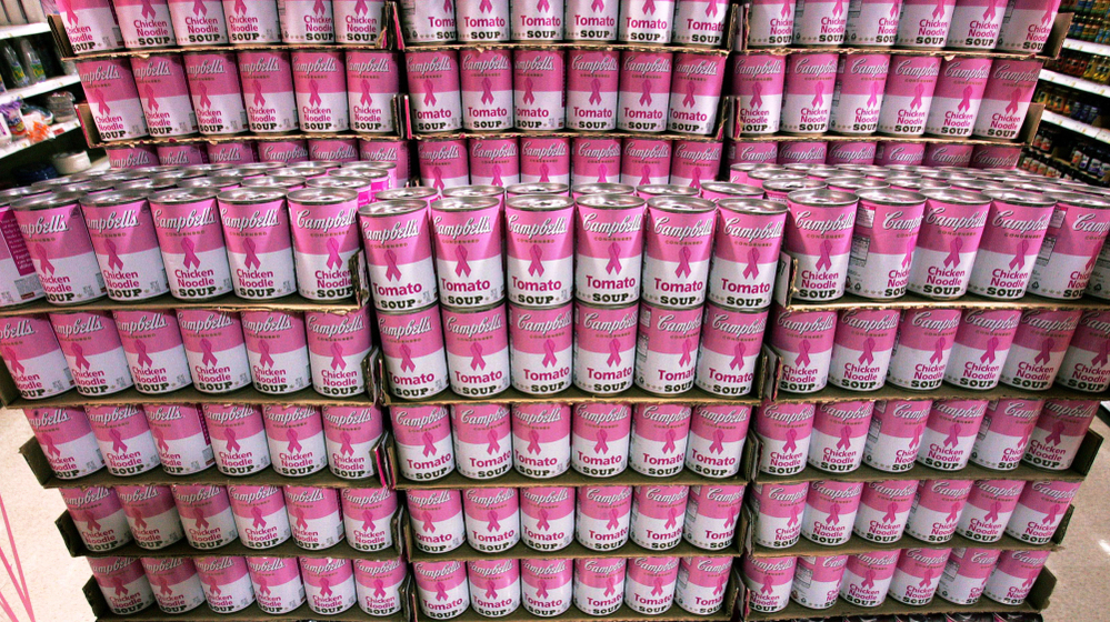Walking arm in arm with charities offers benefits — and potential backlash — for corporations. Here a large display of pink-labeled Campbell's soups stands in an aisle at a New Jersey Wegman's store in 2007. 