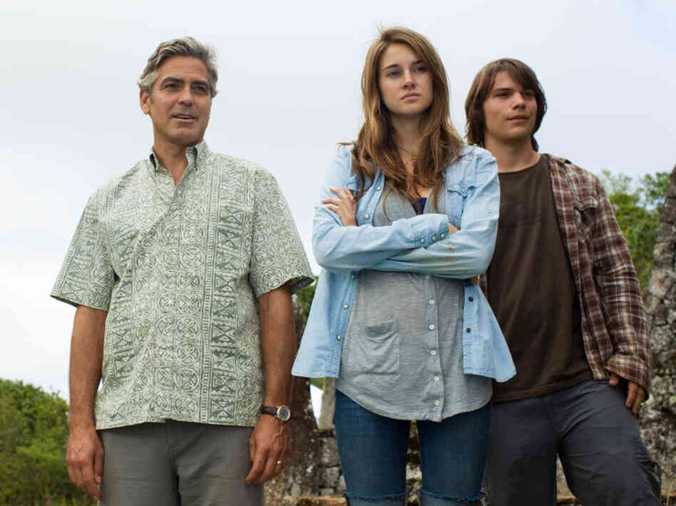 George Clooney as Matt King, Shailene Woodley as Alexandra King, and Nick Krause as Sid in The Descendants. George Clooney as Matt King, Shailene Woodley as Alexandra King, and Nick Krause as Sid in The Descendants.