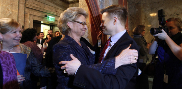 Gov. Chris Gregoire (left) embraces Rep. Jamie Pedersen, a Seattle Democrat, after the Washington state House voted Wednesday to legalize gay marriage.