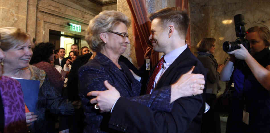 Gov. Chris Gregoire (left) embraces Rep. Jamie Pedersen, a Seattle Democrat, after the Washington state House voted Wednesday to legalize gay marriage.