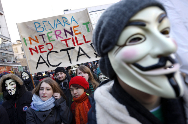 Protesters, some wearing Guy Fawkes masks, take part in a demonstration in Stockholm on Saturday to protest the Swedish government's plan to ratify the Anti-Counterfeiting Trade Agreement.