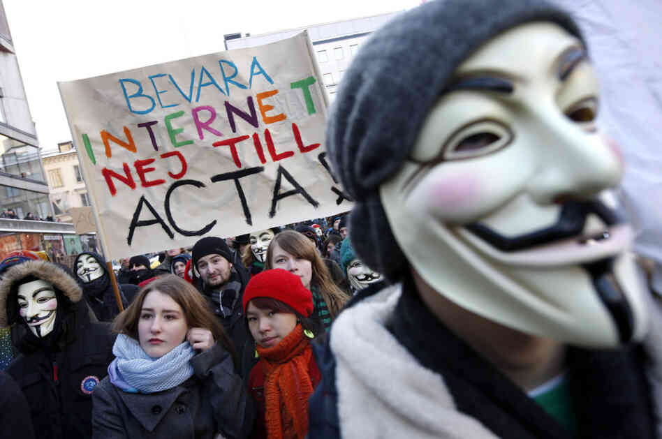 Protesters, some wearing Guy Fawkes masks, take part in a demonstration in Stockholm on Saturday to protest the Swedish government's plan to ratify the Anti-Counterfeiting Trade Agreement.