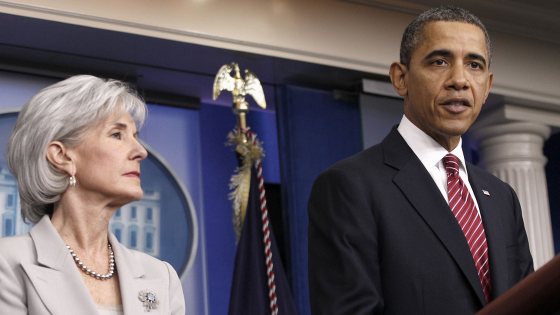 President Obama, flanked by Health and Human Services Secretary Kathleen Sebelius, announces the revamp of the contraception-care policy on Friday.