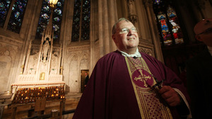 Archbishop Timothy M. Dolan, head of the U.S. Conference of Catholic Bishops, shown at Ash Wednesday services at Saint Patrick's Cathedral last year, has called the Obama administration's decision "a first step in the right direction."