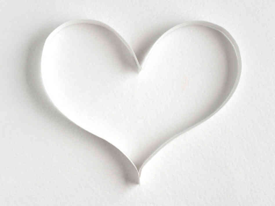 Heart made of paper on white background Heart made of paper on white background
