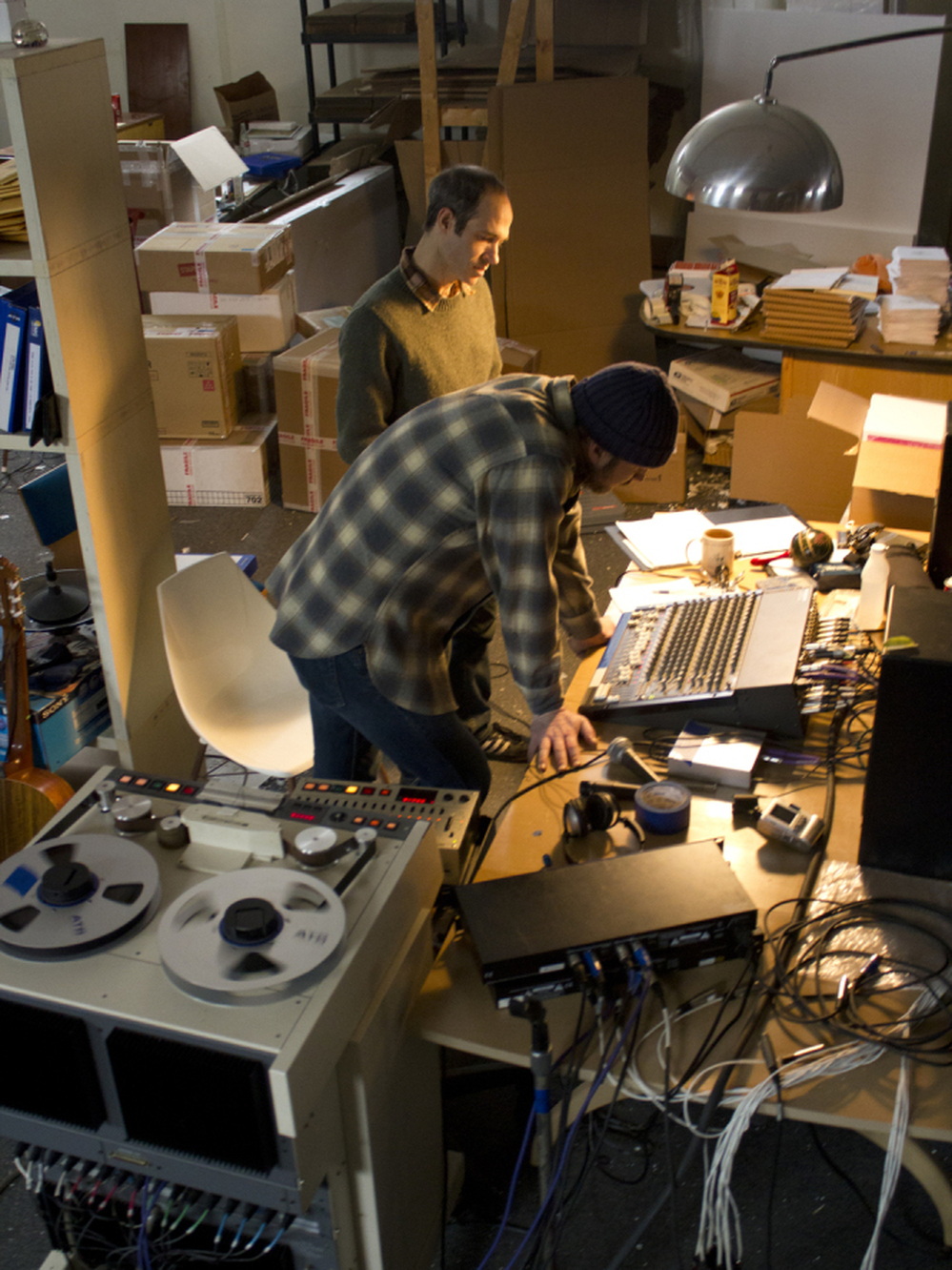 Joyner (rear) at work in his warehouse studio with guitarist Mike Friedman.