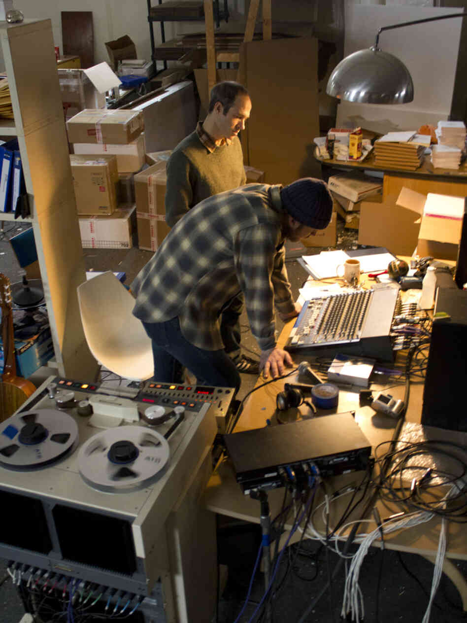 Joyner (rear) at work in his warehouse studio with guitarist Mike Friedman.