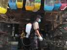 A government veterinarian worker sprays anti-bird flu disinfectant over birds and fowls at Medan city market in North Sumatra province. Indonesia reported its second human death from bird flu this year in late January. A government veterinarian worker sprays anti-bird flu disinfectant over birds and fowls at Medan city market in North Sumatra province. Indonesia reported its second human death from bird flu this year in late January.