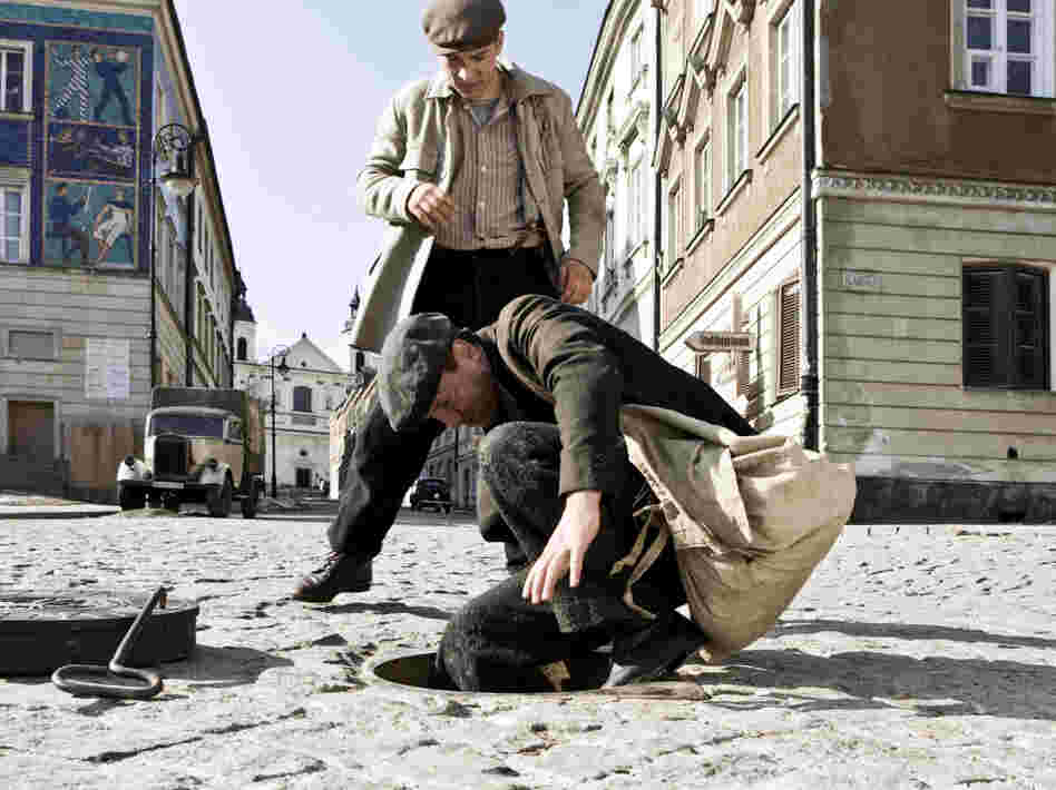 Socha (Robert Wieckiewicz, foreground, with Krzysztof Skonieczny) is portrayed as a man with mixed motivations — a hero almost in spite of himself. Socha (Robert Wieckiewicz, foreground, with Krzysztof Skonieczny) is portrayed as a man with mixed motivations — a hero almost in spite of himself.