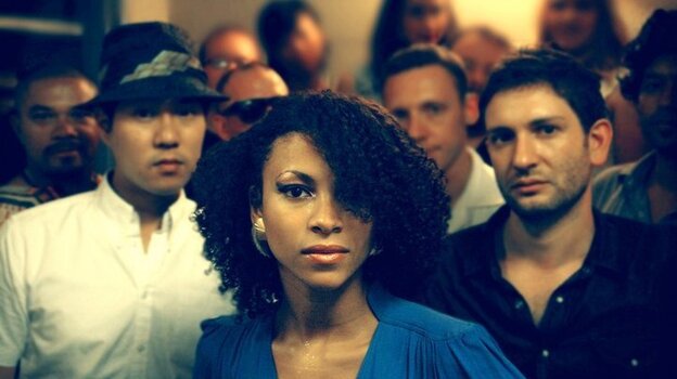 Singer Adeline Michèle, center, fronts the disco band Escort. Cofounders Eugene Cho and Dan Balis stand to her left and right, respectively.
