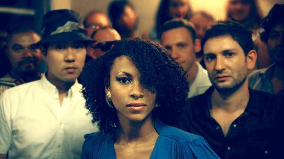 Singer Adeline Michèle, center, fronts the disco band Escort. Cofounders Eugene Cho and Dan Balis stand to her left and right, respectively.