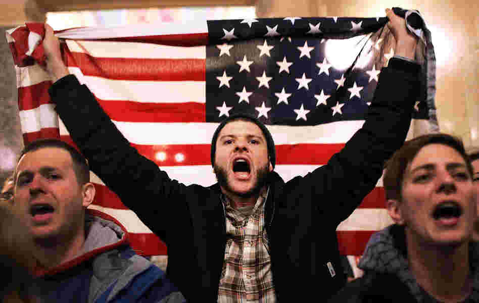 For so many reasons, Americans are seething. Here, a protester shouts as he holds an American flag after storming the Wisconsin state Capitol in Madison last March, after Republicans in the state Senate voted to curb collective bargaining rights for public workers.
