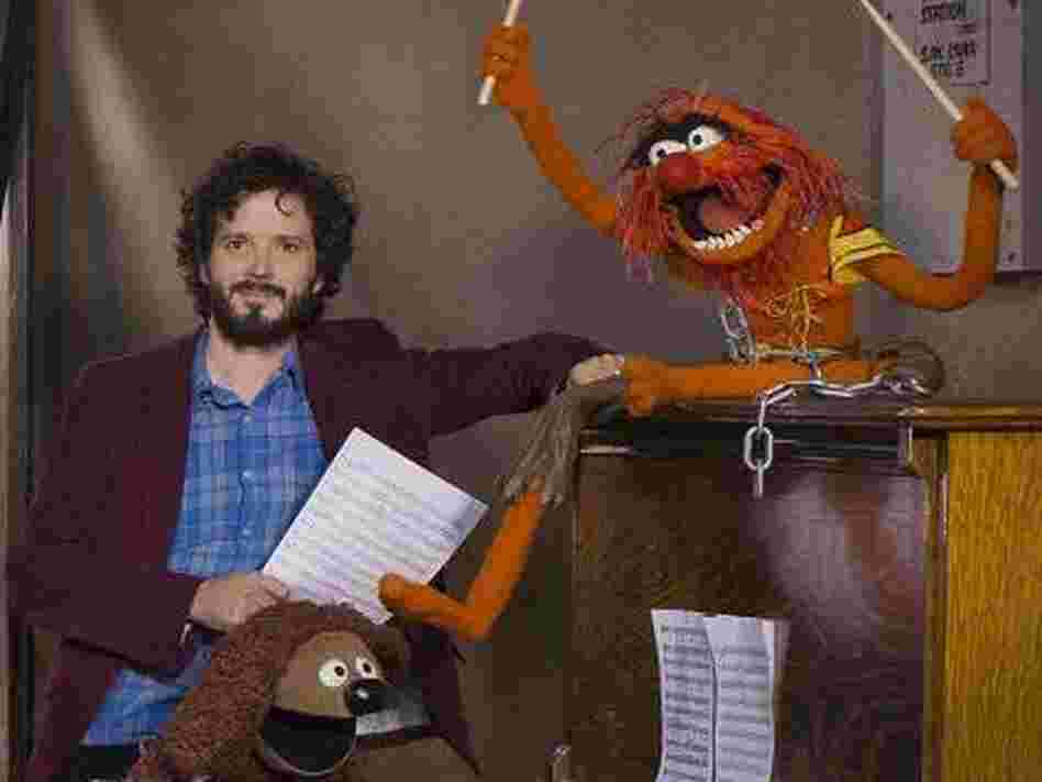 Bret McKenzie (left) wrote five of the songs in The Muppets, including the Oscar-nominated "Man or Muppet" and the opening number, "Life's a Happy Song." Bret McKenzie (left) wrote five of the songs in The Muppets, including the Oscar-nominated "Man or Muppet" and the opening number, "Life's a Happy Song."