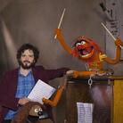 Bret McKenzie (left) wrote five of the songs in The Muppets, including the Oscar-nominated "Man or Muppet" and the opening number, "Life's a Happy Song." Bret McKenzie (left) wrote five of the songs in The Muppets, including the Oscar-nominated "Man or Muppet" and the opening number, "Life's a Happy Song."