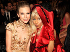 The improbable pair of country star Taylor Swift and rapper Nicki Minaj sitting together at the Staples Center Sunday night. The improbable pair of country star Taylor Swift and rapper Nicki Minaj sitting together at the Staples Center Sunday night.