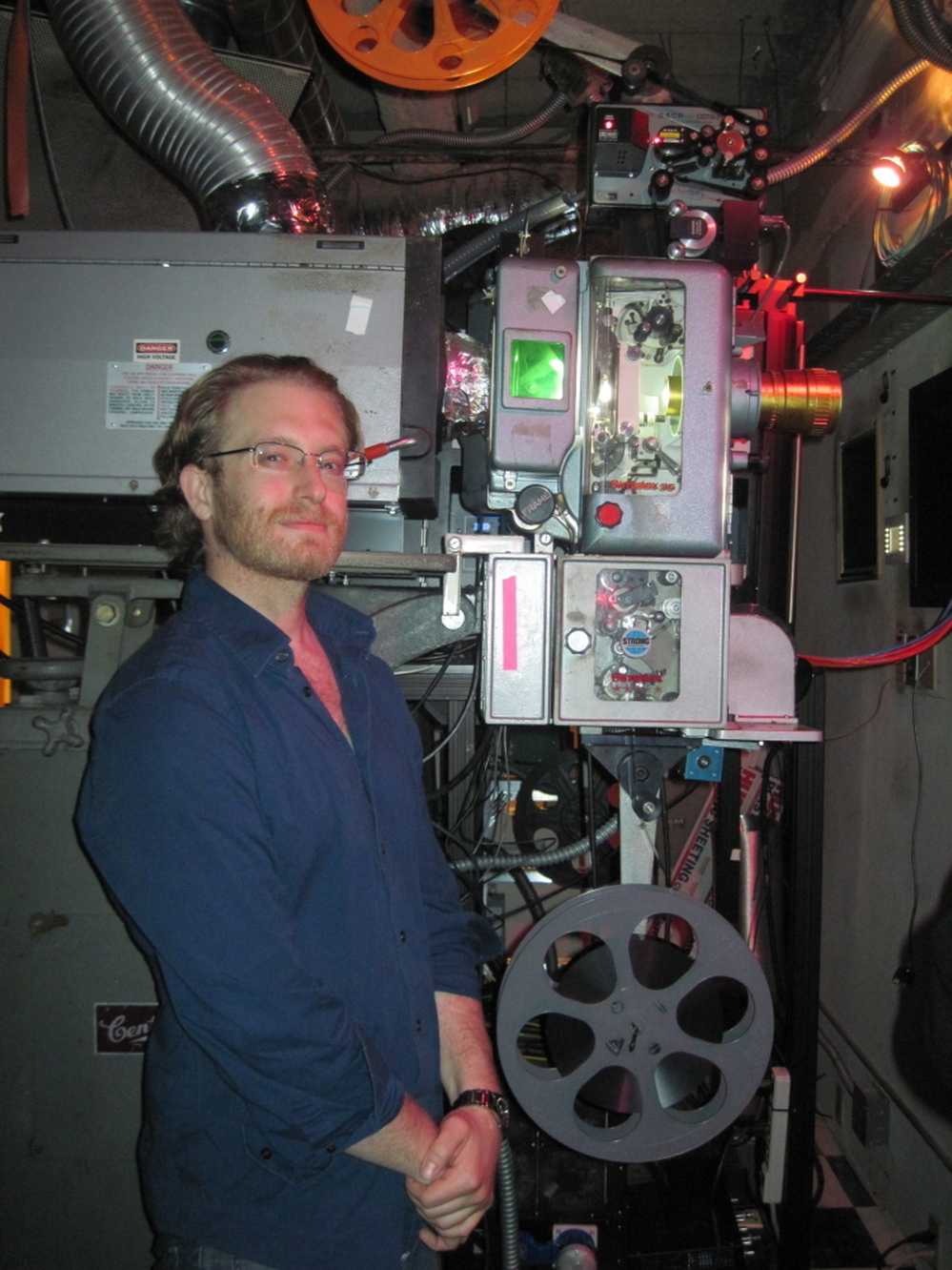 Josh Aidikoff mastered the complicated business of running film projectors when he was still in his teens. Now, the Aidikoff Screening Room has a digital projector, too, and Josh predicts that in a few years he won't be handling film at all.