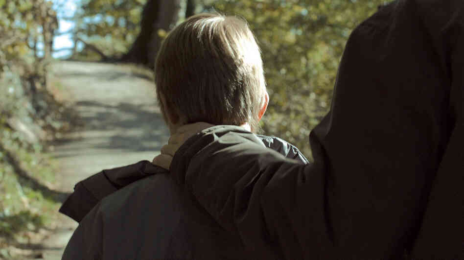 Insurance agent and bourgeois pedophile Michael (Michael Fuith) takes Wolfgang (David Rauchenberger), the 10-year-old boy he's holding captive, on a rare trip outside. Insurance agent and bourgeois pedophile Michael (Michael Fuith) takes Wolfgang (David Rauchenberger), the 10-year-old boy he's holding captive, on a rare trip outside.