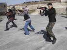 Syrian rebels aim during a weapons training exercise outside Idlib, Syria on Tuesday. Syrian government forces renewed their assault on the rebellious city of Homs on Tuesday in what activists described as the heaviest shelling in days. Syrian rebels aim during a weapons training exercise outside Idlib, Syria on Tuesday. Syrian government forces renewed their assault on the rebellious city of Homs on Tuesday in what activists described as the heaviest shelling in days.