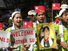 Ethnic Karen women welcome opposition leader Aung San Suu Kyi to War Thein Kha village. The area is in Kawhmu Township, which Suu Kyi is campaigning to represent in Myanmar's parliament. Ethnic Karen women welcome opposition leader Aung San Suu Kyi to War Thein Kha village. The area is in Kawhmu Township, which Suu Kyi is campaigning to represent in Myanmar's parliament.
