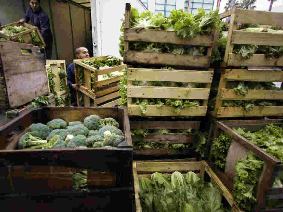 Edgar Jaime (right) and his brother Jose Luis unload organic vegetables from their farm in Santa Monica, Calif. Now that U.S. and European organic standards are equivalent, more American organic farmers will be able to export to Europe.