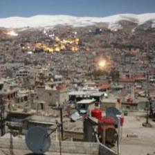 An image from the Local Coordinating Committees of Syria website shows the mountain town of Zabadani in the distance, during a barrage on Feb. 9.