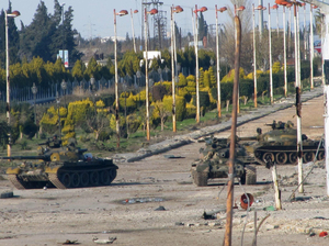 Syrian army tanks are seen stationed at the entrance to Baba Amr neighbourhood in Homs on Feb. 13, 2012. Syria ignored a new Arab initiative to end the bloodshed, with its troops pounding the protest hub of Homs as Russia said a ceasefire is needed before peacekeepers can be deployed. Syrian army tanks are seen stationed at the entrance to Baba Amr neighbourhood in Homs on Feb. 13, 2012. Syria ignored a new Arab initiative to end the bloodshed, with its troops pounding the protest hub of Homs as Russia said a ceasefire is needed before peacekeepers can be deployed.