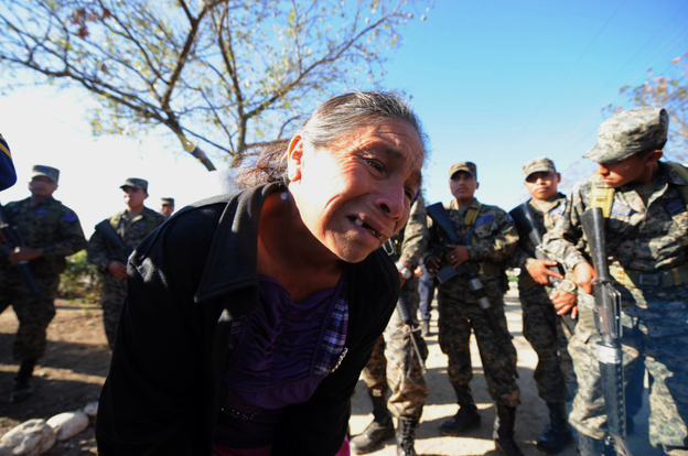 A woman cries after she was informed of the death of her son, who was jailed at the National Prison compound in Comayagua, Honduras.