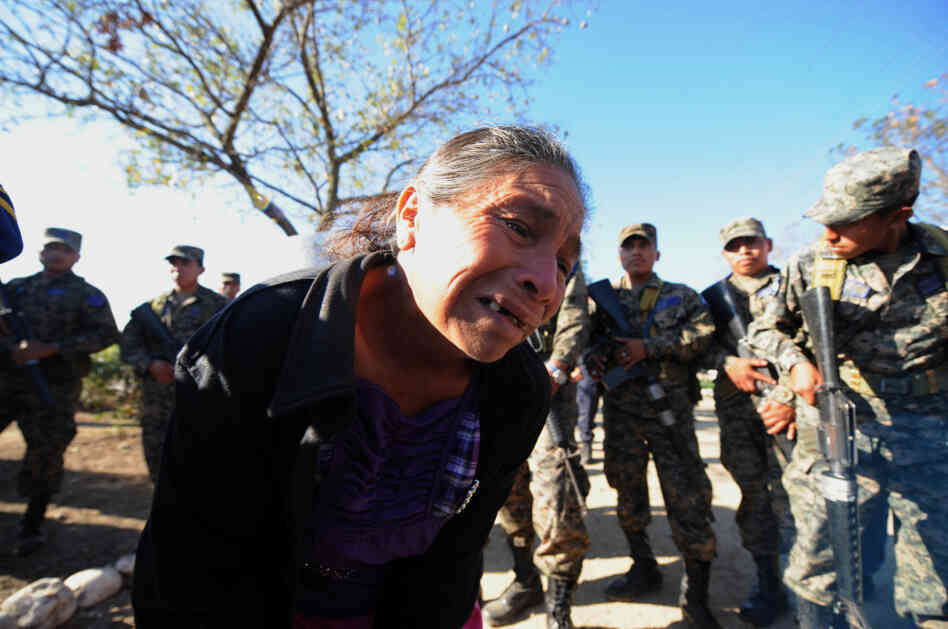 A woman cries after she was informed of the death of her son, who was jailed at the National Prison compound in Comayagua, Honduras.
