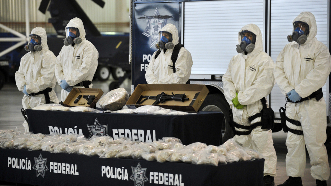 Mexican police show the drug and weapons seized from Jaime Herrera Herrera, an alleged drug cartel member, in Mexico City on Tuesday.