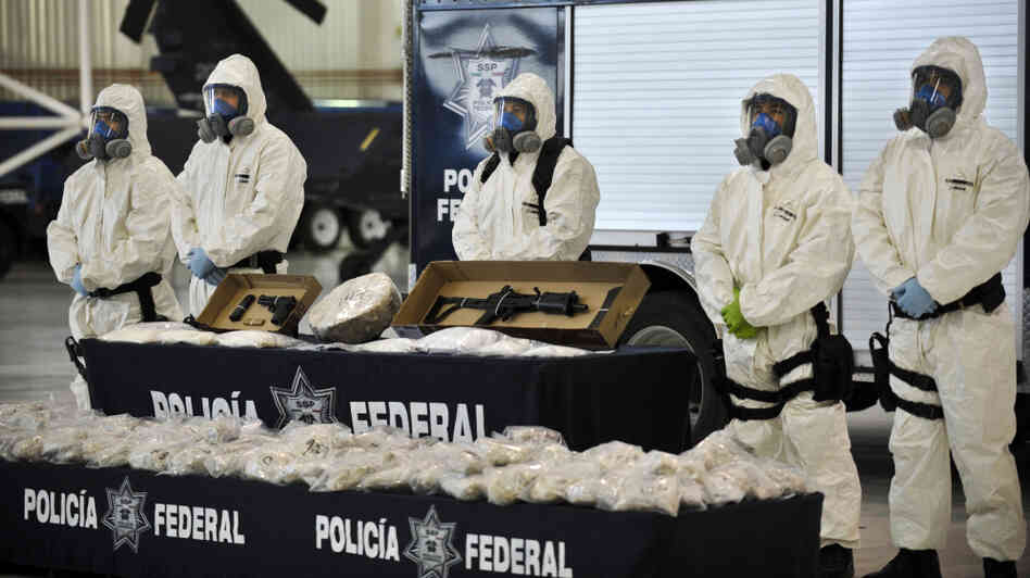 Mexican police show the drug and weapons seized from Jaime Herrera Herrera, an alleged drug cartel member, in Mexico City on Tuesday.