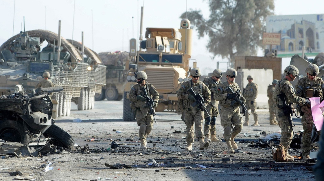 U.S. soldiers are expected to be in Afghanistan for a couple more years. But already there's a debate about future U.S. security needs worldwide. Here, soldiers examine the site of a suicide bombing in the southern Afghan city of Kandahar on Jan. 19.