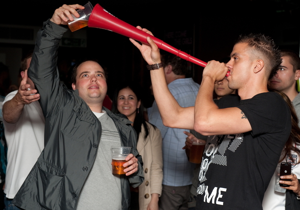 Prime Minister David Cameron calls binge drinking "one of the scandals of our society." Here, a man drinks a pint of beer through a makeshift "Vuvuzela of Ale" in London, in a file photo from 2010.