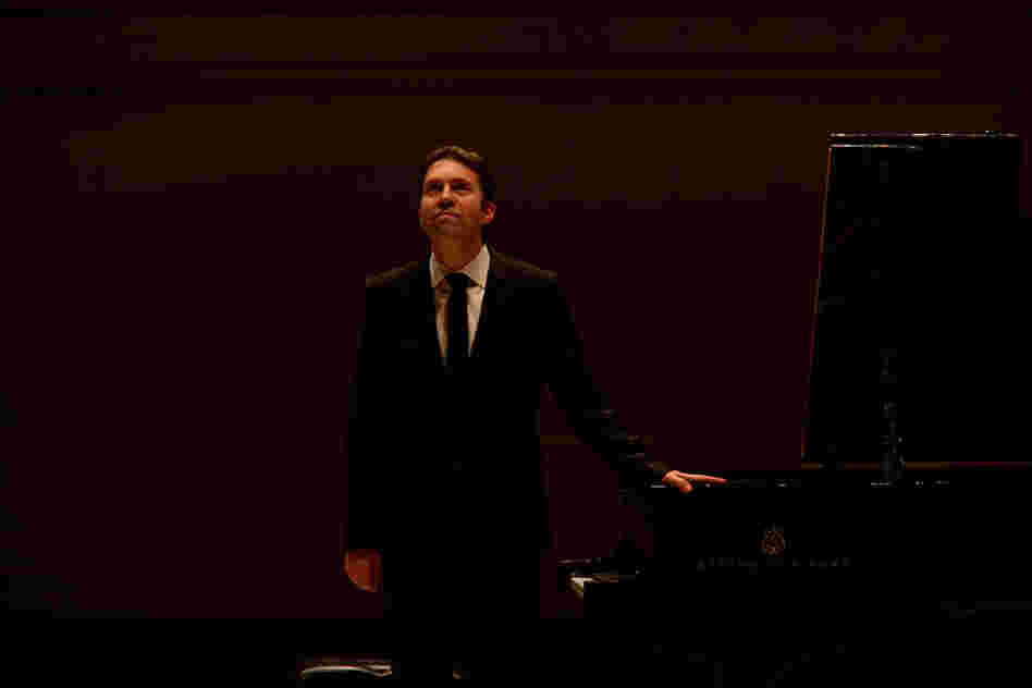 Gazing up to the balcony at Carnegie Hall, Andsnes  acknowledges the enthusiastic applause from a full house of  admirers.