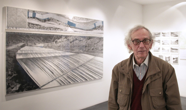 Christo stands next to one of his works at a 2010 exhibition in Paris about the Over the River project. If approved, the installation could begin in the fall.
