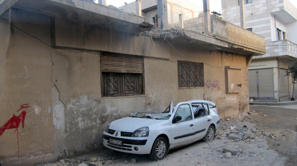 A handout picture from a Syrian opposition activist taken on Feb. 13 shows damages in the Baba Amro neighborhood in the flashpoint Syrian city of Homs.