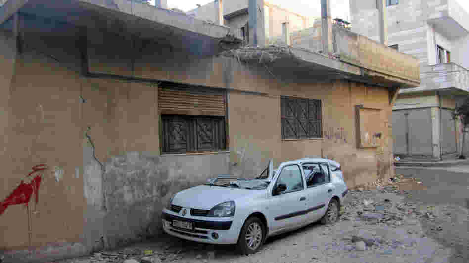 A handout picture from a Syrian opposition activist taken on Feb. 13 shows damages in the Baba Amro neighborhood in the flashpoint Syrian city of Homs.