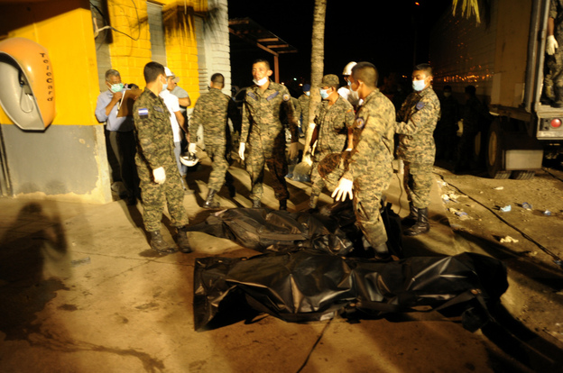Inmates bodies are loaded in a trailer truck at the National Prison in Comayagua, north of Tegucigalpa.